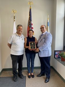 Chamber President Hassan Nijem present a plaque in gratitude to Ald. Silvana Tabares for helping to save Chicago's Arab owned Hookah lounges and saving more than 200 jobs in the city. Photo courtesy of Ray Hanania
