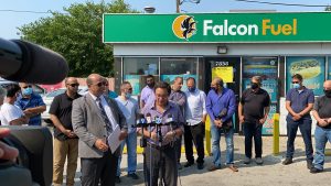 Chicago Alderman Raymond Lopez (15th Ward) joins Chamber president Hassan Nijem and 25 gas and grocery store owners. Photo courtesy Ray Hanania