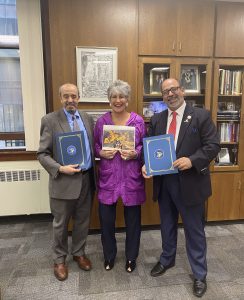 Samir Khalil of the Arab American Democratic Club and Hassan Nijem of the American Arab Chamber of Commerce accept recognitions on behalf of their members from Cook County Treasurer Maria Pappas