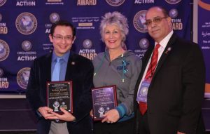 Chicago Alderman Raymond Lopez and Cook County Treasurer Maria Pappas accept the ACTION Award for supporting the Arab American and Muslim community at a dinner banquet Dec. 9, 2021